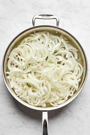Onions slowly caramelizing in butter and oil.