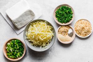 ingredients laid out for Cheddar And Onion Cheeseball chives, cream cheese
