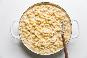 staring together the sauce and noodles for Classic Baked Macaroni And Cheese