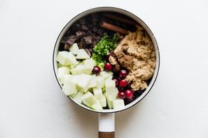 fresh cranberries, brown sugar, jalapeño, apples, dried figs, cinnamon in a saucepan