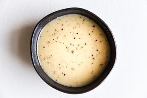 creamy maple salad dressing in a black bowl