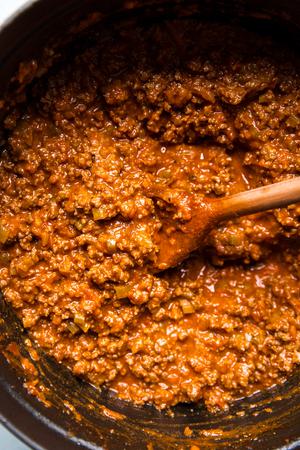 pot of easy bolognese with a wooden spoon