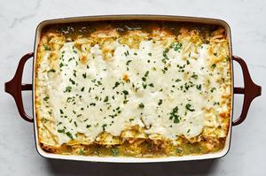 homemade green chicken enchiladas filled with chicken, cheese, sour cream and taco seasoning