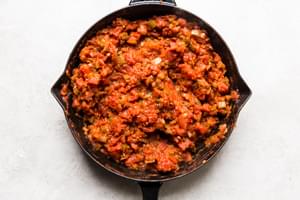 shakshuka sauce in a cast iron skillet