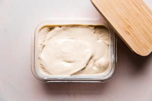 homemade hot buttered rum batter in a freezer container.