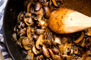 large pot of mushrooms sautéed with butter and onions