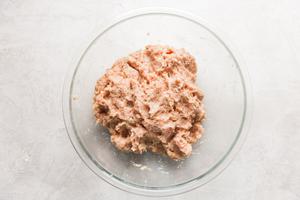 Italian chicken meatball ingredients mixed together in a bowl