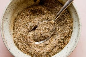 bowl with a spoon and homemade jamaican jerk spice blend
