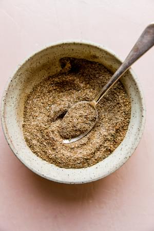 bowl with a spoon and homemade jamaican jerk spice blend