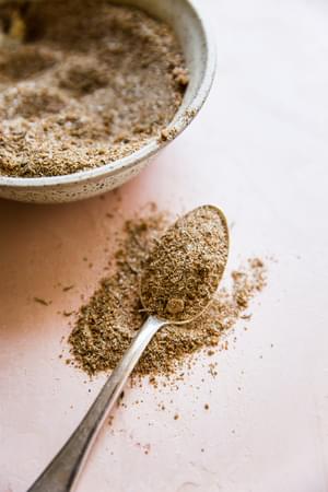 spoon filled with homemade jamaican jerk spice blend