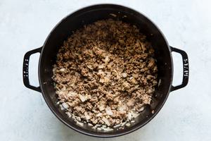 Italian sausage, beef, onion sautéed in a pot