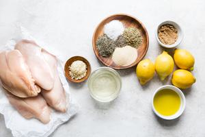 4 raw chicken breasts, 4 lemons, olive oil, lemon juice, brown sugar, minced garlic, garlic powder, salt, pepper and oregano