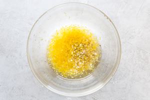 white wine, garlic, lemon zest, lemon juice, brown sugar, and salt in a bowl.