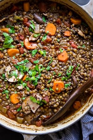 large pot of french lentil stew with quinoa and mushrooms