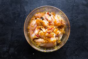 Mango Chutney mixed with Chicken thighs in a bowl