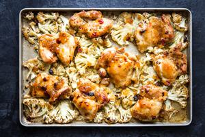 Mango Chutney Sheet Pan Chicken With Cauliflower on a baking sheet