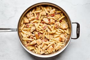 a pan of marry me chicken pasta made with sun-dried tomatoes, cream, Parmesan and Italian seasoning