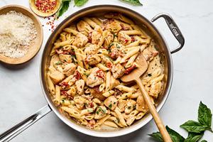 a pan of marry me chicken pasta made with sun-dried tomatoes, cream, Parmesan and Italian seasoning