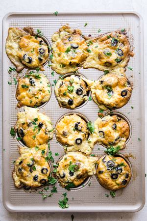 muffin tin filled with egg and sausage muffins