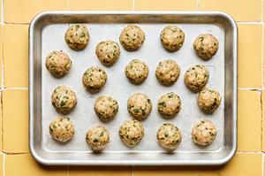 raw ground chicken miso meatballs on a rimmed sheet pan