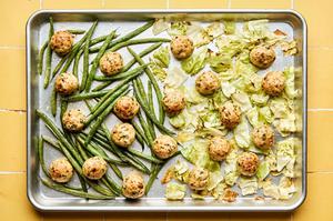chicken meatballs, green beans and cabbage roasted on a sheet pan