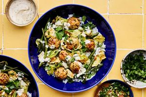 Chicken meatballs served on top of white rice, roasted green beans and cabbage and drizzled with miso ranch sauce