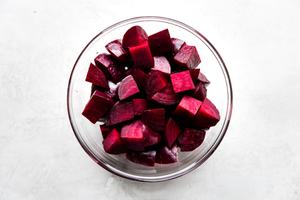 cooked red beets cubed and in a large glass bowl