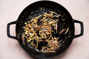cooked shallots and garlic in a frying pan