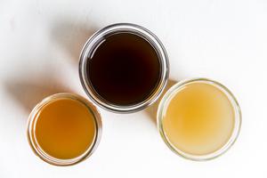 Chicken stock, beef stock, vegetable stock in jars