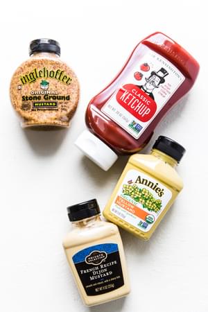 bottles of stone ground mustard, organic ketchup, yellow mustard and dijon mustard
