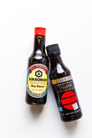 A bottle of Soy Sauce and a bottle of Tamari
