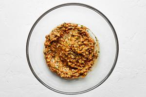 peanut butter, garlic, soy sauce, sesame oil, white vinegar, green onions, cilantro, ground ginger & salt combined in a bowl