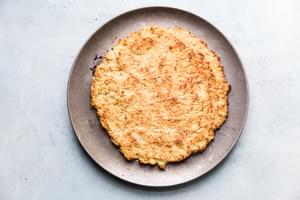 cauliflower pizza crust on a pizza pan