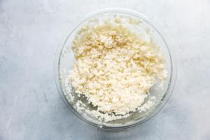 crumbled cooked cauliflower in a bowl