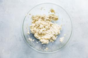 crumbled cooked cauliflower, 1 egg and cream cheese mixed together in a bowl