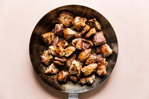 skillet with crispy pork bites