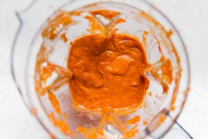 homemade salsa bravas in a blender made with olive oil, onion, garlic diced tomatoes, white wine vinegar and spices
