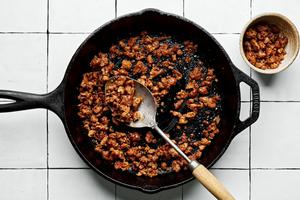 pork chorizo being cooked in a skillet