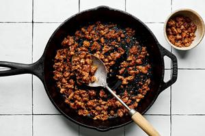 pork chorizo being cooked in a skillet