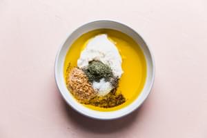 olive oil, mayonnaise, dried dill, salt, pepper, lemon juice and stone ground mustard in a bowl.