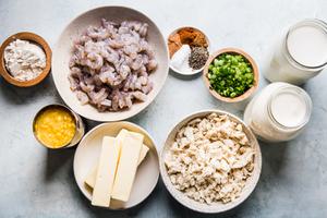 ingredients for seafood bisque in small bowls