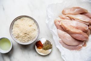 chicken breast, vegetable oil, breadcrumbs, sugar and spices on the counter to make homemade shake and bake chicken