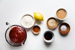 ketchup, horseradish, Worcestershire sauce, mustard, hot sauce, apple sauce, and lemon zest in prep bowls for cocktail sauce