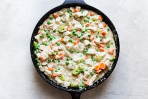 Skillet Chicken Pot Pie filling in a cast iron pan