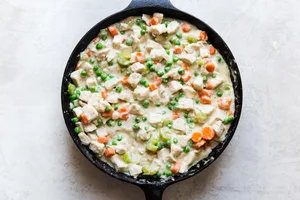 Skillet Chicken Pot Pie filling in a cast iron pan