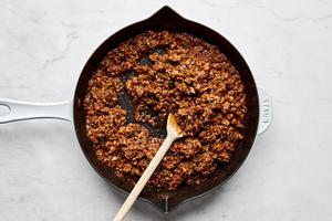 sloppy joe ground beef made with bell pepper, onion, jalapeño, garlic, ketchup, tomato paste, brown sugar and spices in a pan