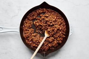 sloppy joe ground beef made with bell pepper, onion, jalapeño, garlic, ketchup, tomato paste, brown sugar and spices in a pan