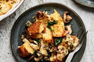 spinach mushroom strata being served on a plate