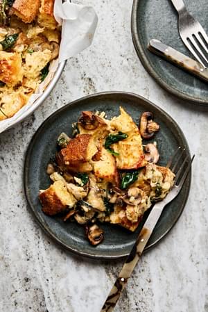 spinach mushroom strata being served on a plate