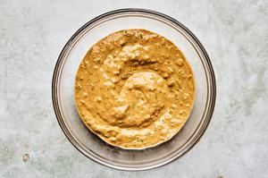 yogurt, lemon juice, ginger, garlic, turmeric, chili powder, cayenne, cinnamon, cumin, cilantro & salt mixed in a bowl